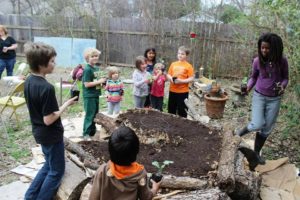 Children's Garden building a keyhole garden bed in Lorena, TX.